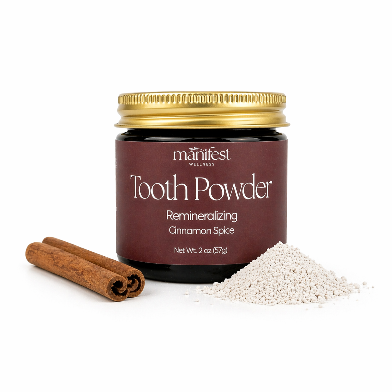Manifest Wellness Cinnamon Spice Tooth Powder jar with cinnamon sticks and tooth powder on a white background