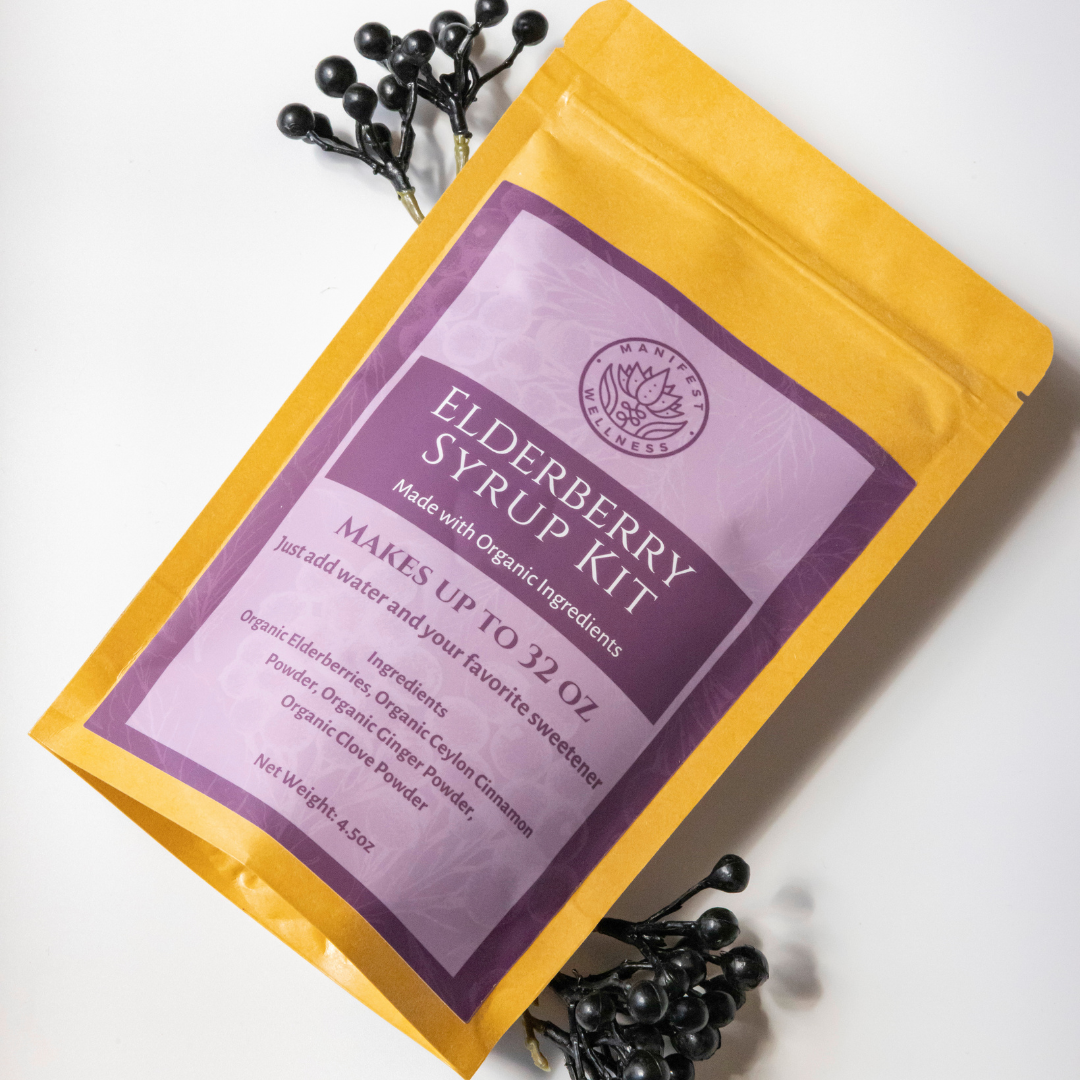 An Elderberry Syrup Kit package with a purple label, yellow background, and including organic ingredients displayed around it.