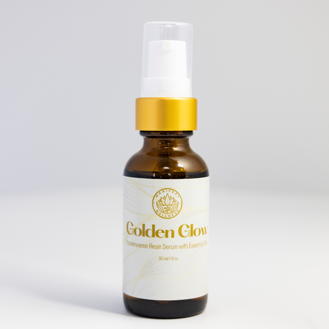 A 1 oz amber glass bottle of Golden Glow Serum with a gold treatment pump lid.