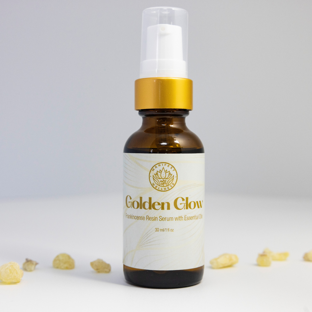 A 1 oz amber glass bottle of Golden Glow Serum with a gold treatment pump lid.