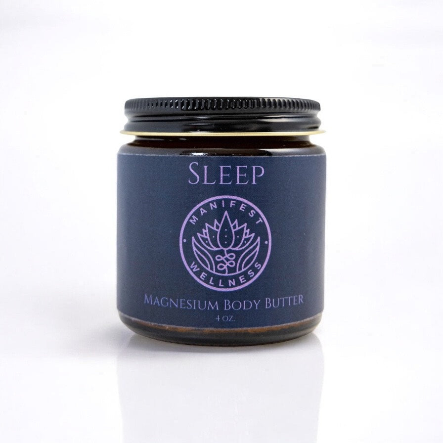 A glass jar of Sleep magnesium body butter from Manifest Wellness on a white background