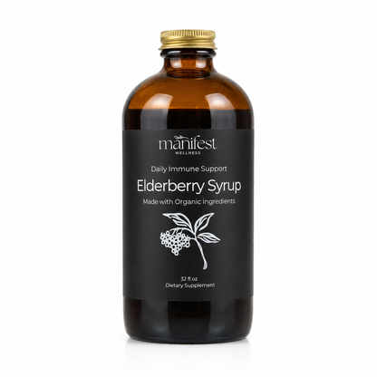 A 32 fl oz amber glass bottle of Manifest Wellness Elderberry Syrup with a black label and gold cap, shown on a white background.