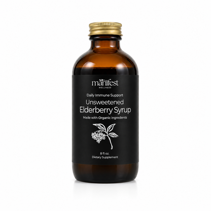 An 8 fl oz amber glass bottle of Manifest Wellness Unsweetened Elderberry Syrup with a black label and gold cap, shown on a white background.