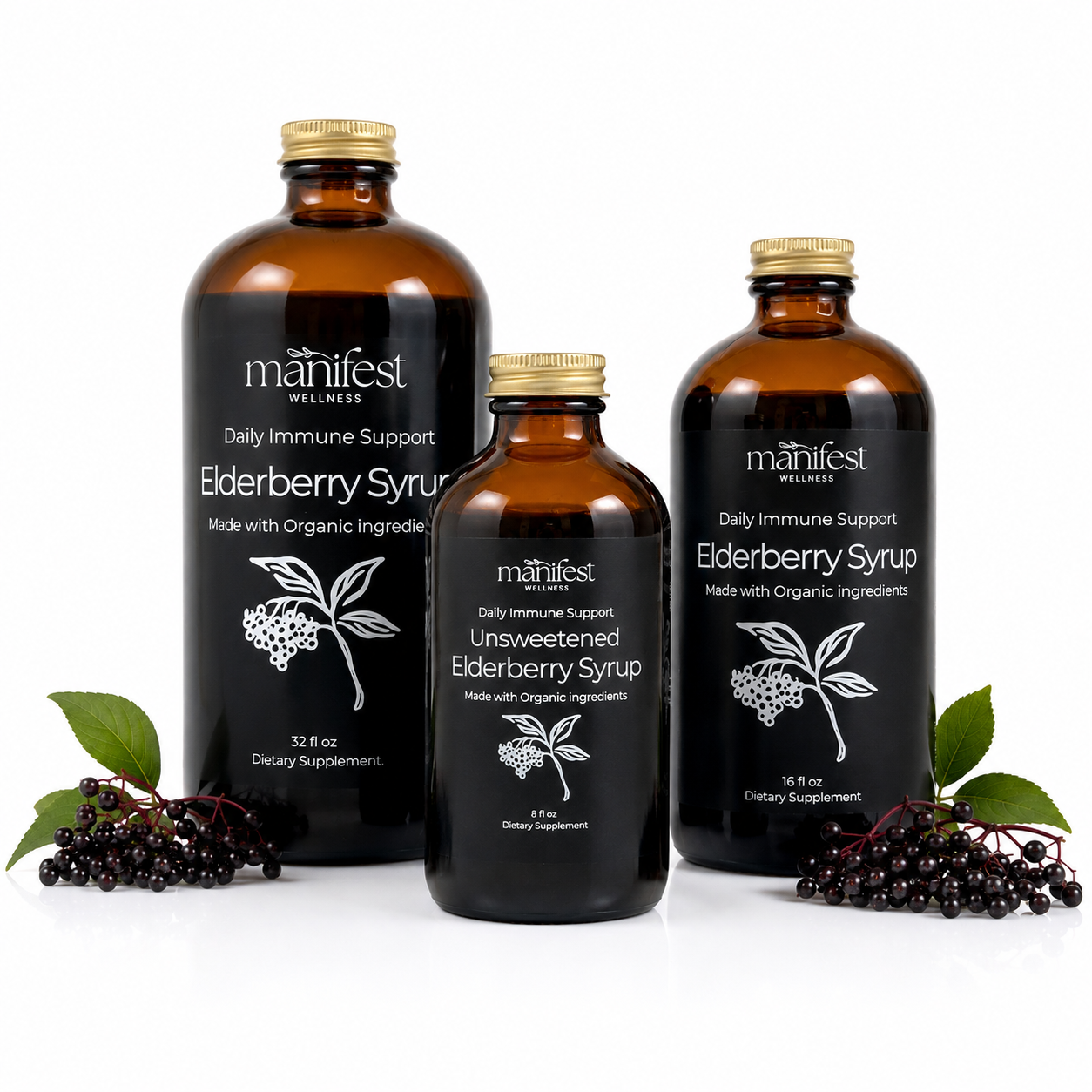 Three amber glass bottles of Manifest Wellness Elderberry Syrup in different sizes, arranged on a white background with elderberry berries and leaves at the base.