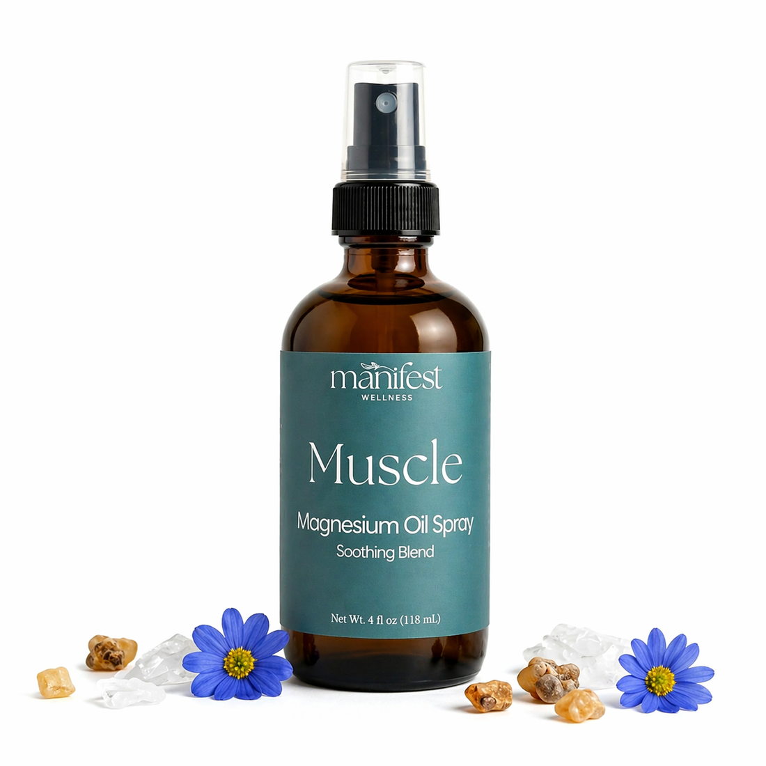 Bottle of Muscle Magnesium Oil Spray by manifest wellness on a white background with blue tansey flowers and frankincense on a white background