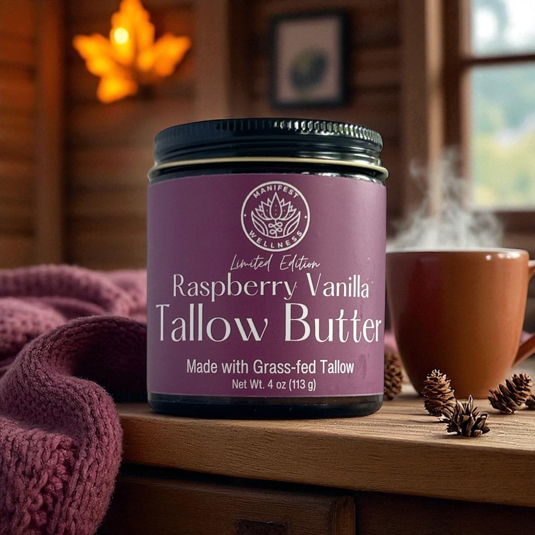 A jar of Raspberry Vanilla Tallow butter in an amber glass jar with a black lid.