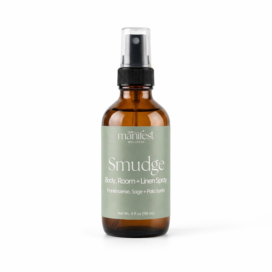 Brown glass bottle of Smudge Spray by Manifest Wellness with a green label on a white background