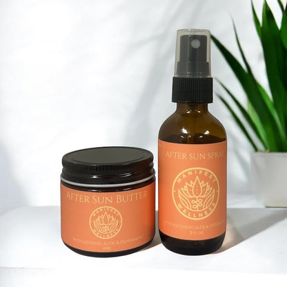 a glass bottle with a black lid and a glass spray bottle with a sprayer lid and orange labels of after sun butter and after sun spray on a white background with an aloe plant behind.