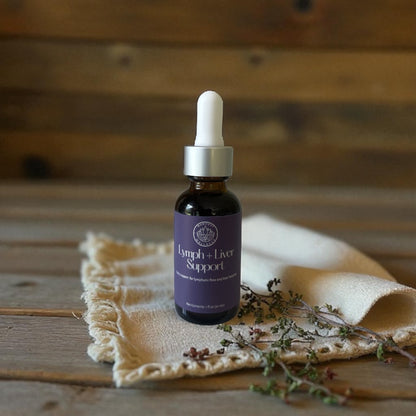 A 1oz amber glass dropper bottle with a white lid of Lymph and Liver Support Tincture