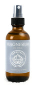 A 4 oz amber glass bottle of Unscented Magnesium Oil Spray with a black sprayer lid.