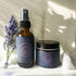 The image shows a Magnesium Sleep Set consisting of a spray bottle and a jar of body butter, both with labels, placed on a surface with a sprig of lavender next to them.